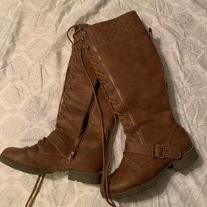 Lace up tall boots. Size 7.5. Brown color